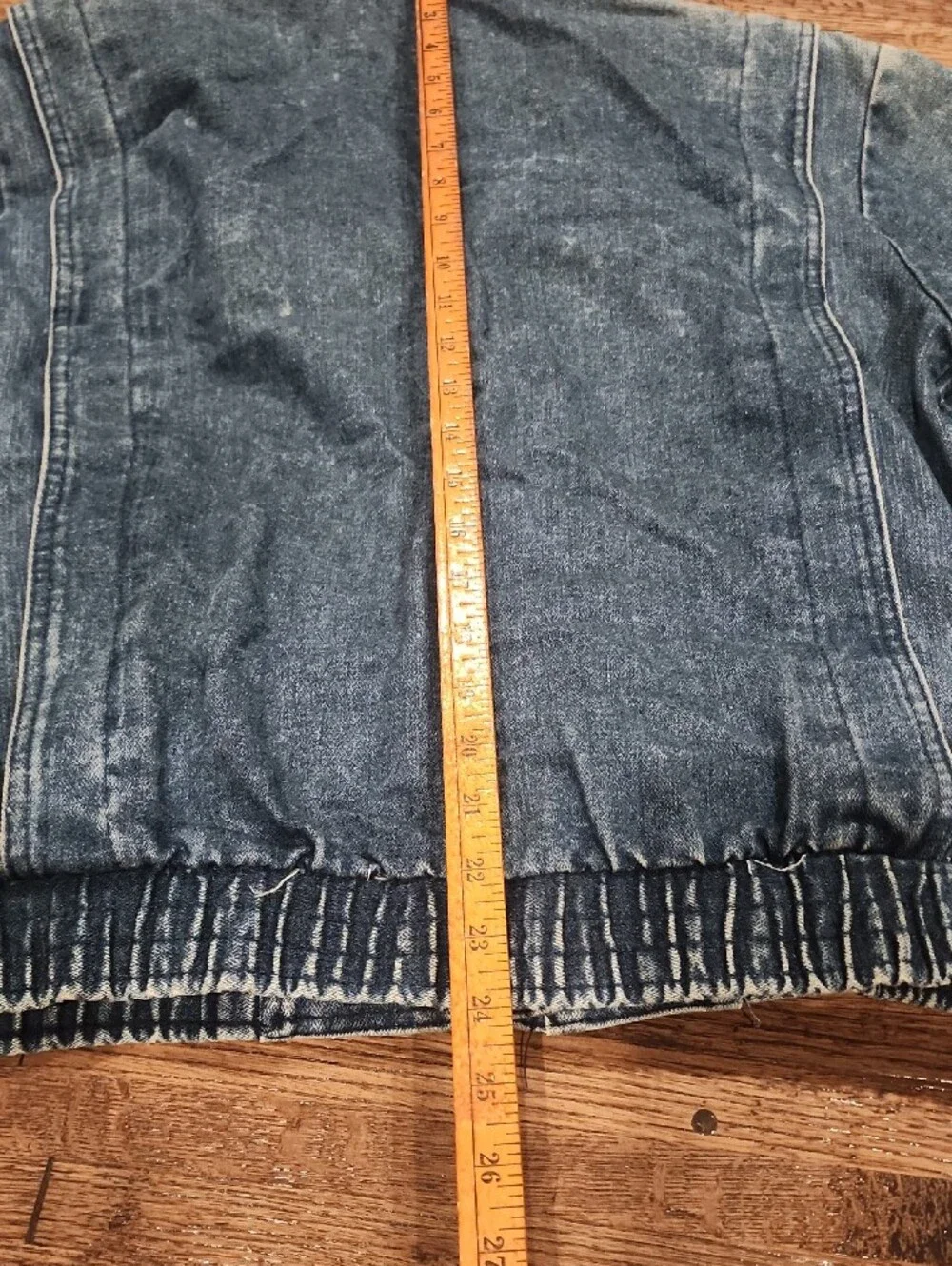 Vtg blue denim bomber jacket featuring a distinctive brown color